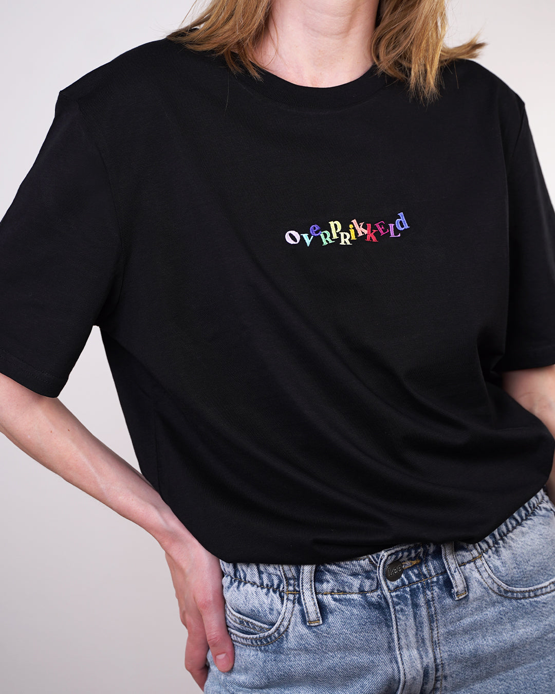 T-shirt Overprikkeld Regenboog – Zwart Unisex 100% Biologisch Katoen (Fair Wear)